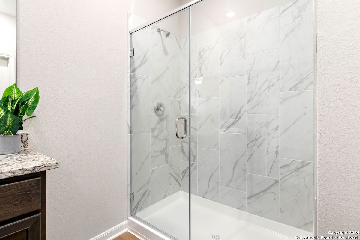 9219 Bennett Forest Converse, TX 78109 - Photo 15 of 23 a bathroom with a shower