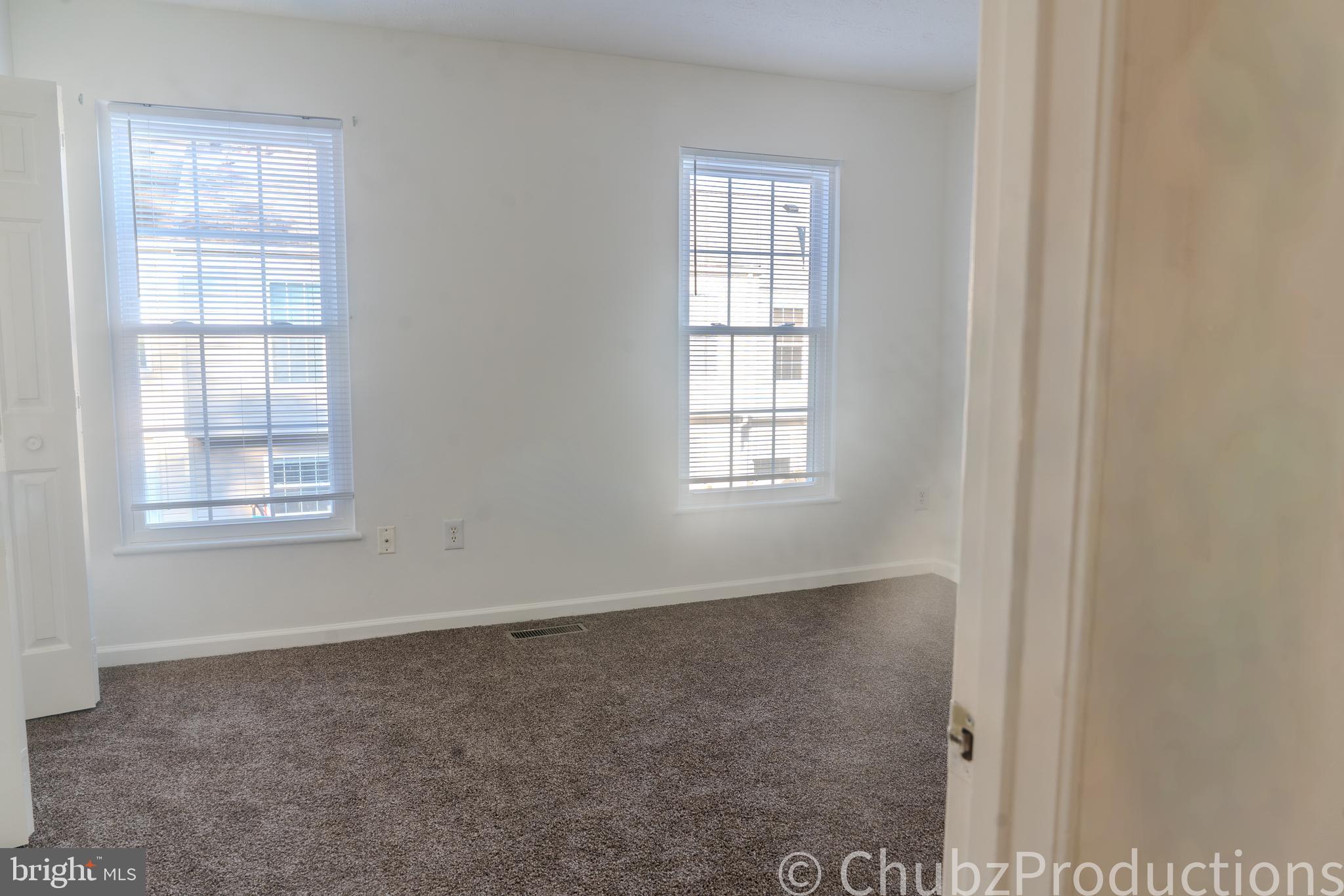 8316 Widgeon Place Laurel, MD 20724 - Photo 14 of 32 an empty room with windows
