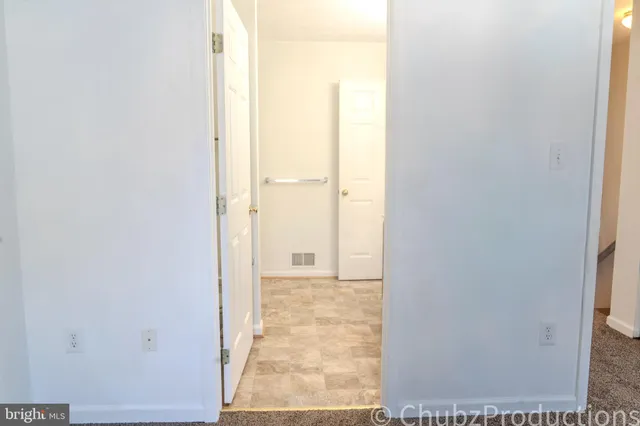 a bathroom with a shower and a toilet