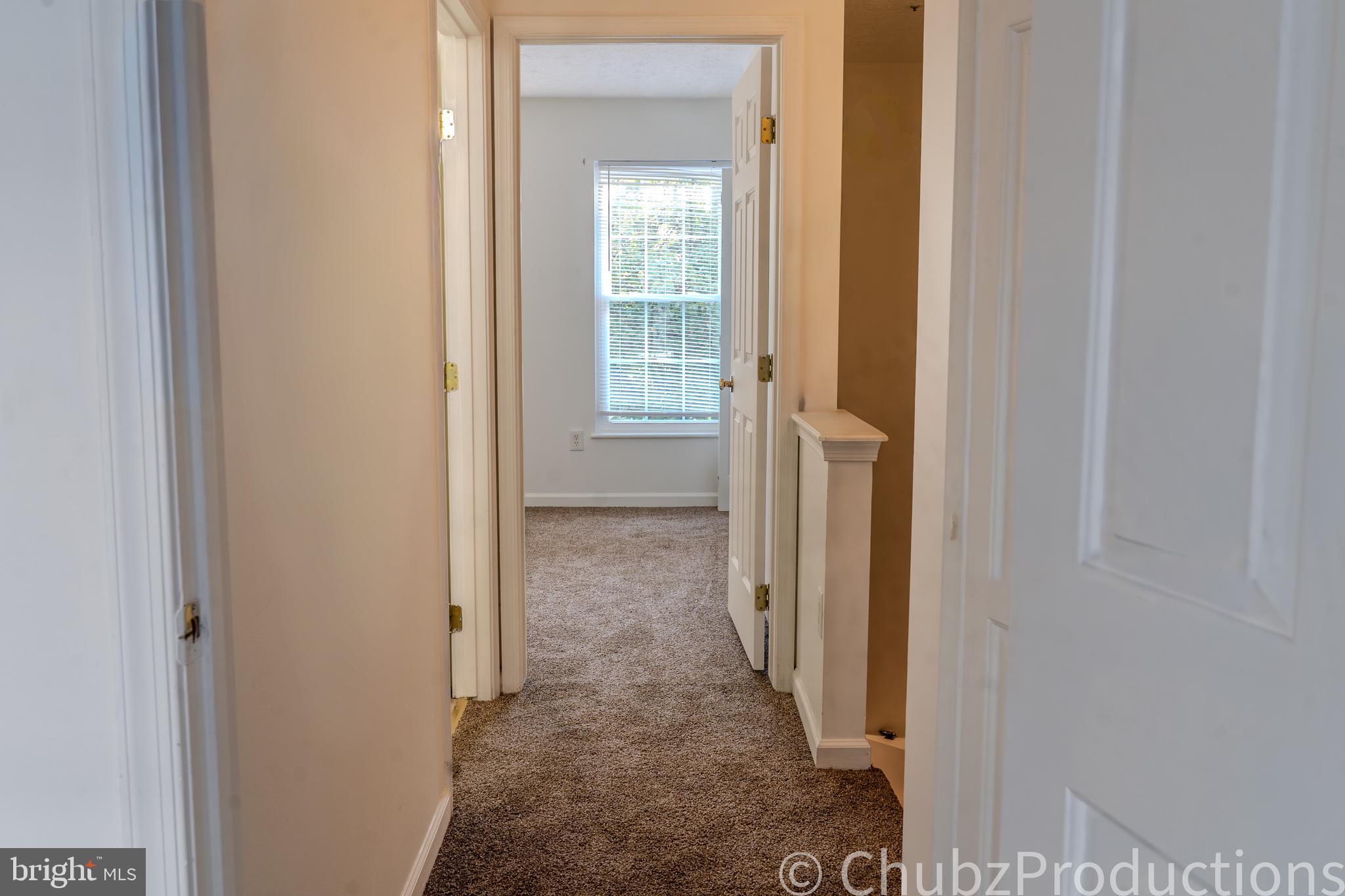 8316 Widgeon Place Laurel, MD 20724 - Photo 21 of 32 a view of a bathroom from a corridor