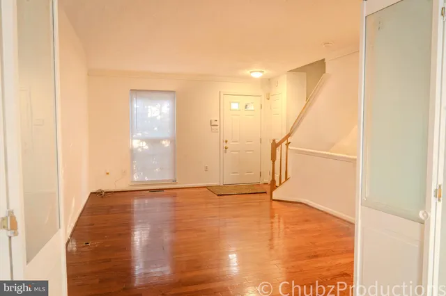 workspace with wooden floor and windows