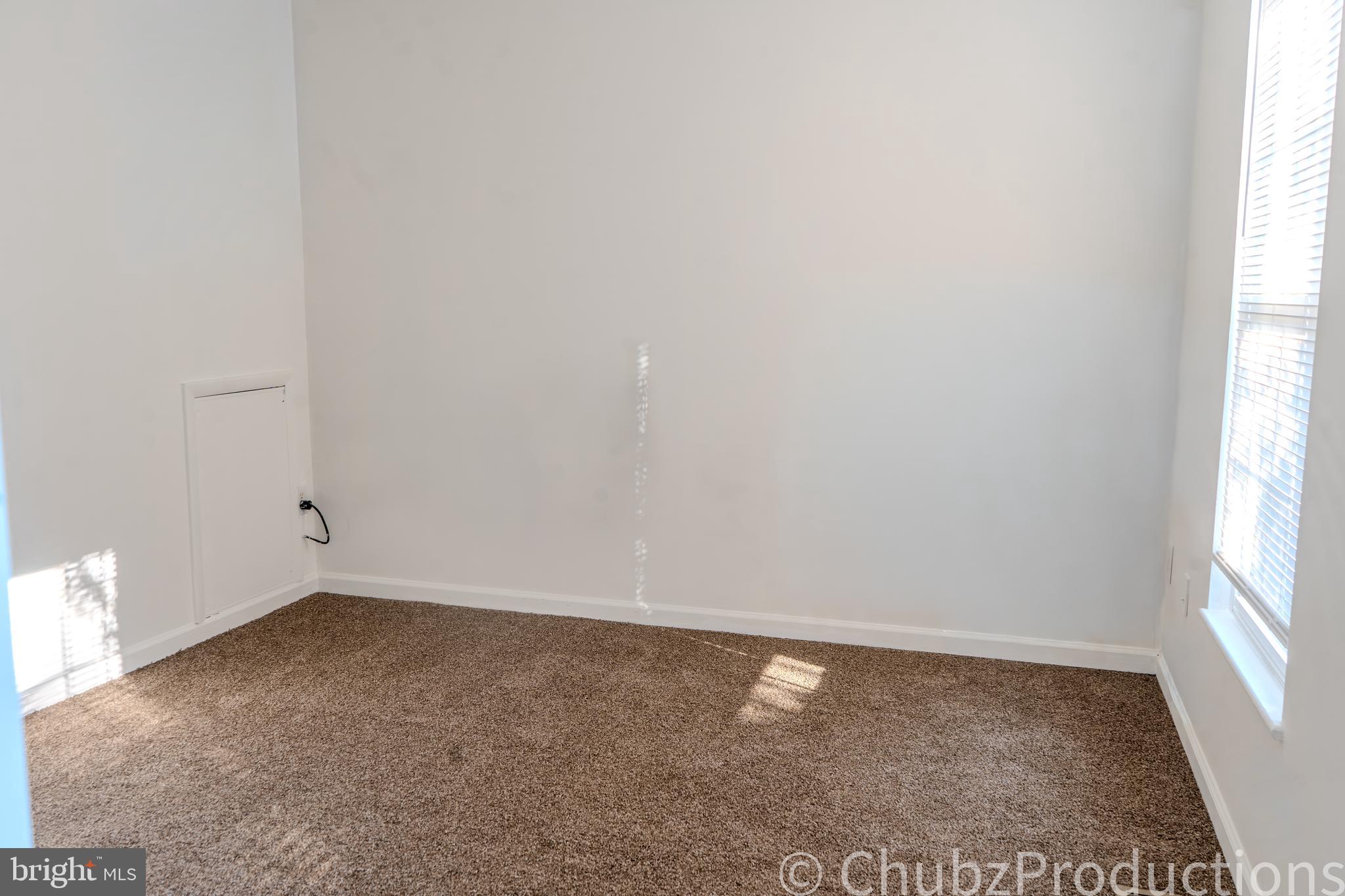 8316 Widgeon Place Laurel, MD 20724 - Photo 3 of 32 an empty room with a window