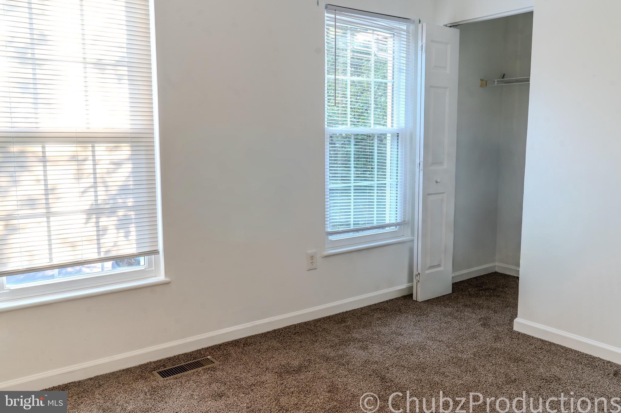 8316 Widgeon Place Laurel, MD 20724 - Photo 4 of 32 an empty room with windows
