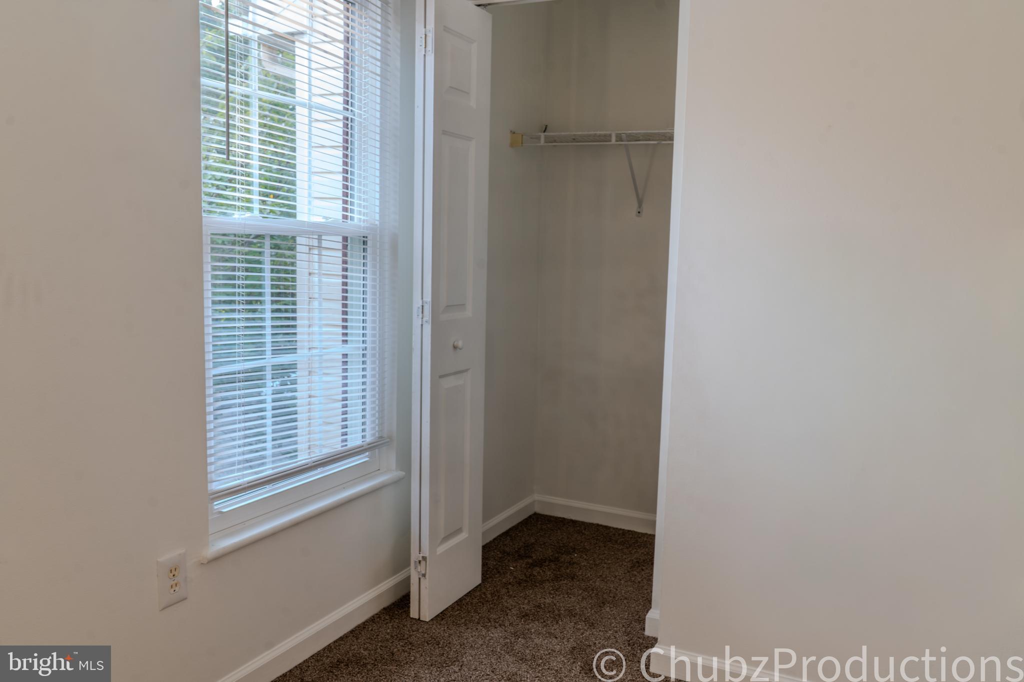8316 Widgeon Place Laurel, MD 20724 - Photo 5 of 32 a view of an empty room with a window