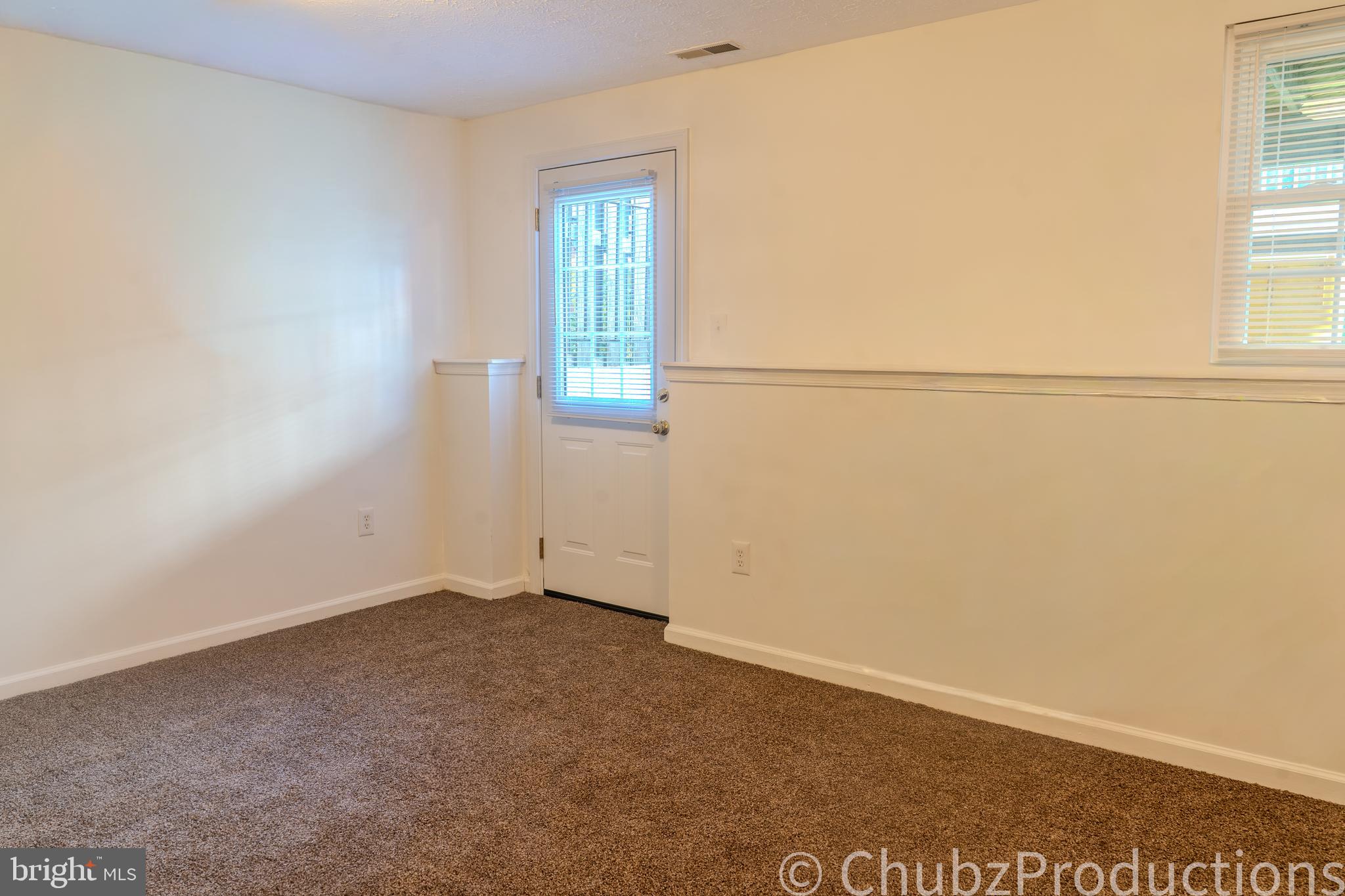 8316 Widgeon Place Laurel, MD 20724 - Photo 9 of 32 an empty room with windows