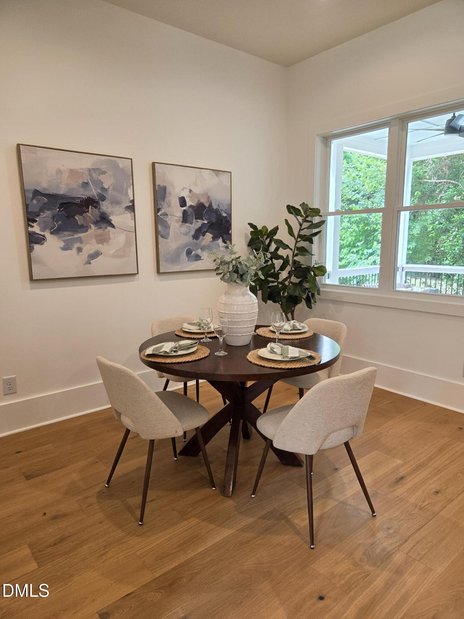 712 Van Buren Road Raleigh, NC 27604 - Photo 14 of 34 a view of a dining room with furniture window and wooden floor