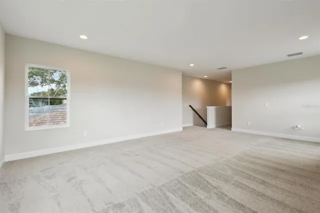 a view of a workspace with furniture and a book shelf