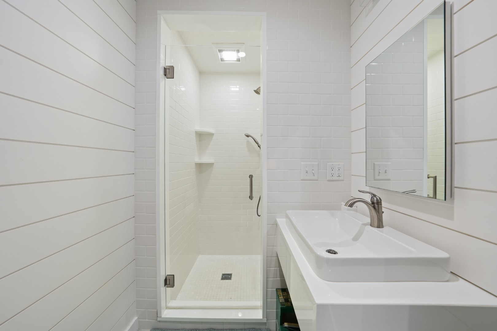 10 Pilgrim Road Nantucket, MA 02554 - Photo 52 of 65 a bathroom with a sink and a mirror