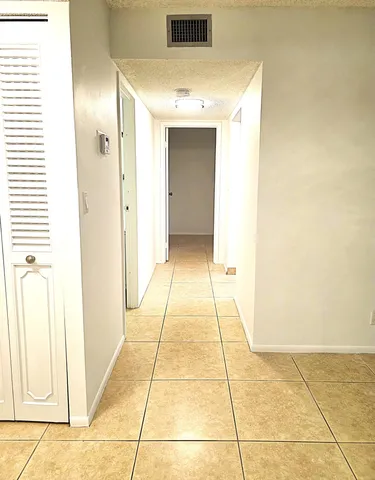 a view of a fountain and a flower garden