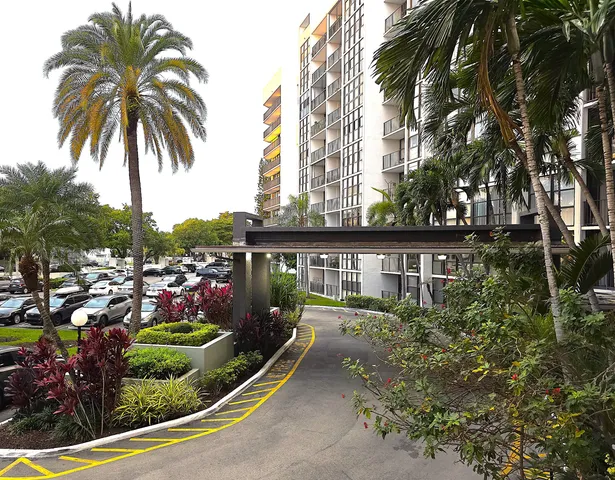 a view of a living room and kitchen
