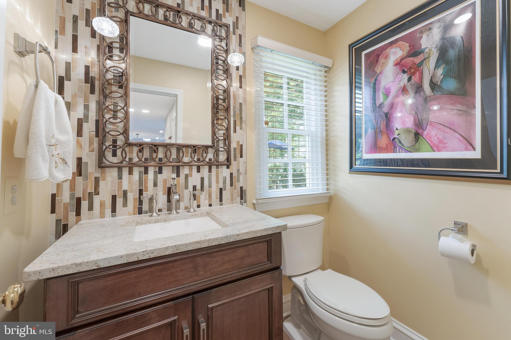 1248 Lamplighter Way Reston, VA 20194 - Photo 14 of 64 a bathroom with a granite countertop sink mirror vanity and toilet