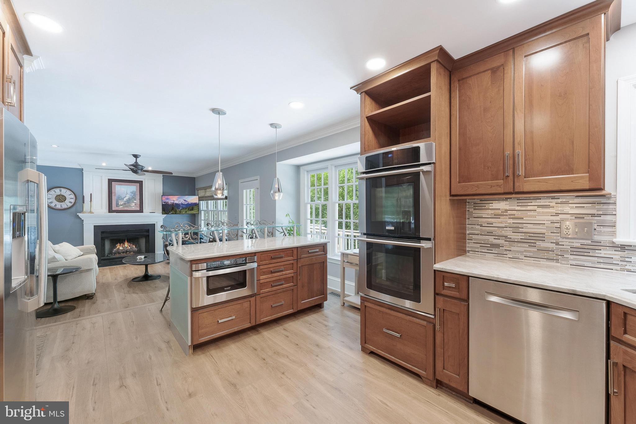1248 Lamplighter Way Reston, VA 20194 - Photo 19 of 64 a kitchen with stainless steel appliances granite countertop a stove and more cabinets