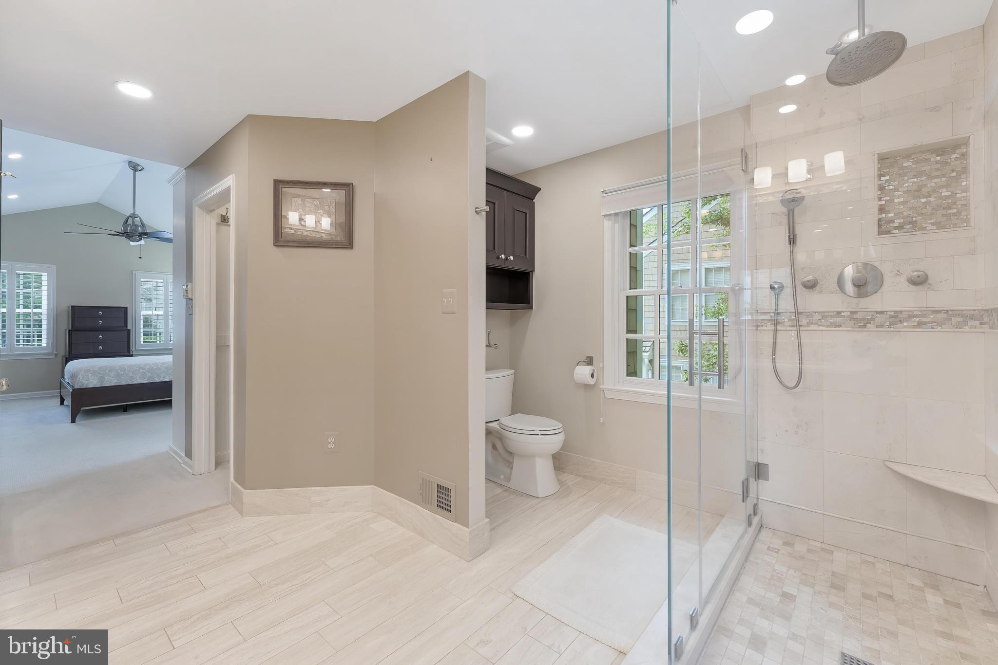 1248 Lamplighter Way Reston, VA 20194 - Photo 31 of 64 a bathroom with a toilet a sink and mirror