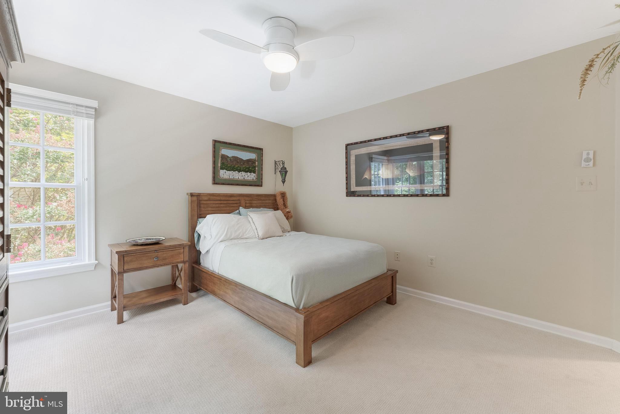 1248 Lamplighter Way Reston, VA 20194 - Photo 34 of 64 a spacious bedroom with a bed and a window