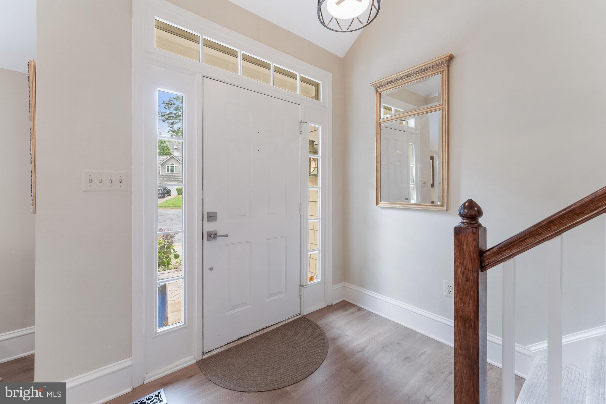 1248 Lamplighter Way Reston, VA 20194 - Photo 4 of 64 a view of an entryway with wooden floor