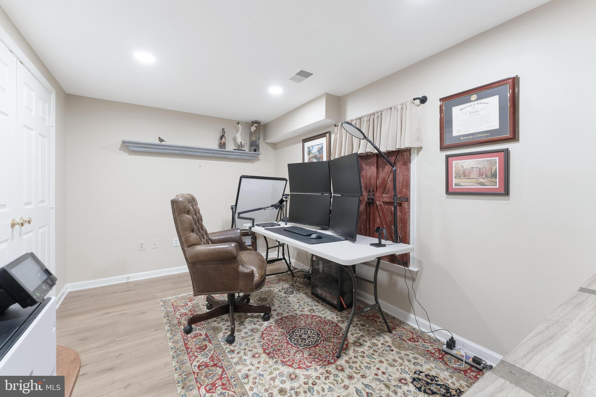 1248 Lamplighter Way Reston, VA 20194 - Photo 45 of 64 a workspace with furniture and wooden floor