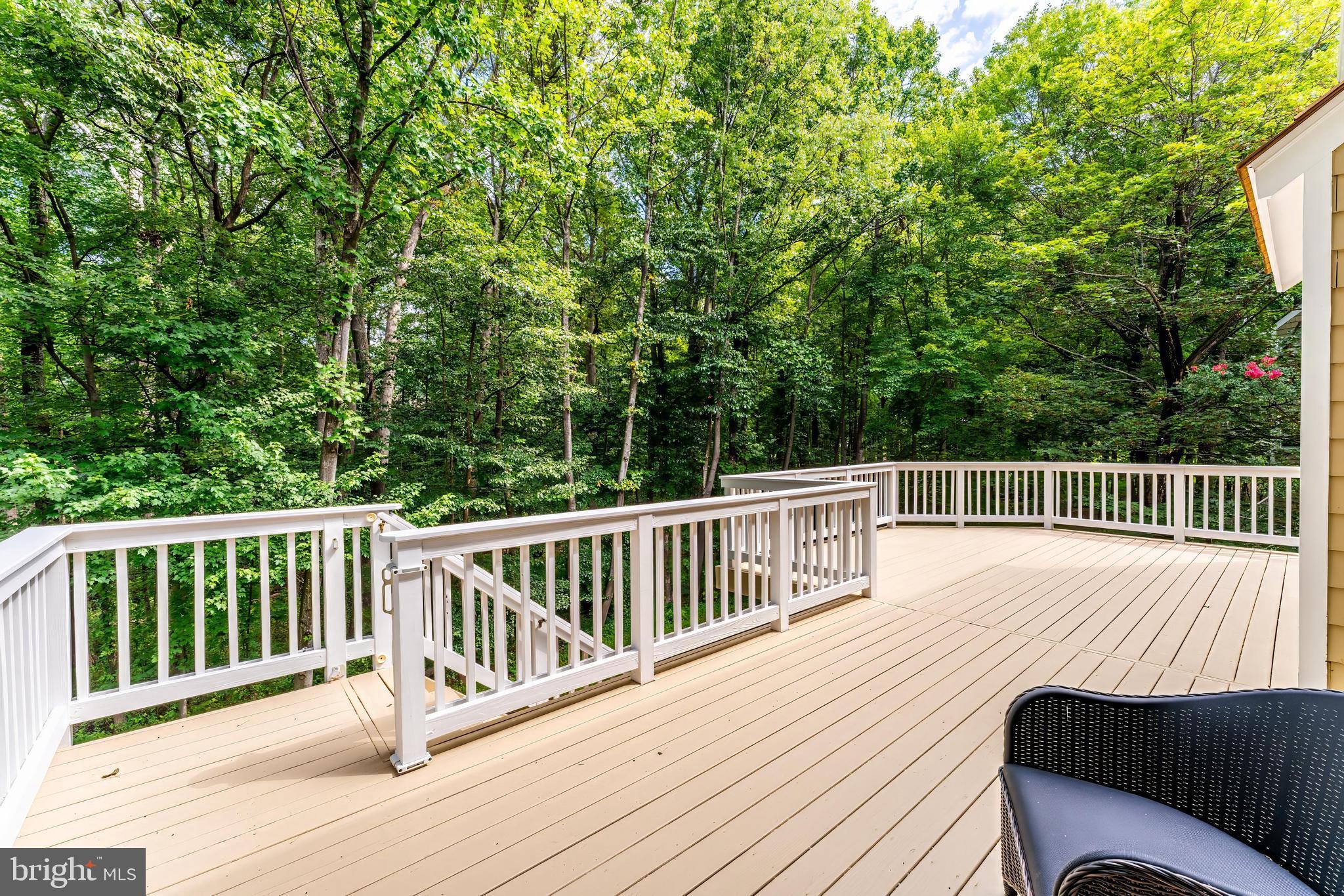 1248 Lamplighter Way Reston, VA 20194 - Photo 49 of 64 a view of a wooden deck and a floor to ceiling window