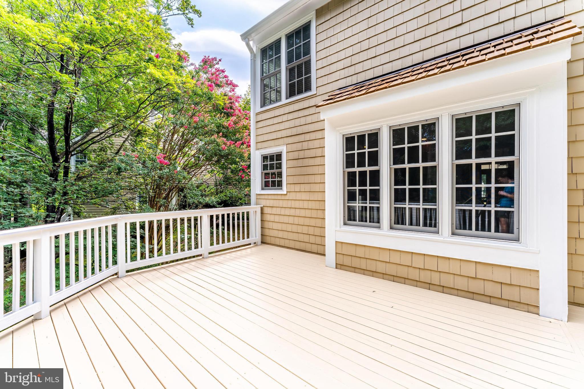 1248 Lamplighter Way Reston, VA 20194 - Photo 53 of 64 a view of a balcony with a large window and wooden fence