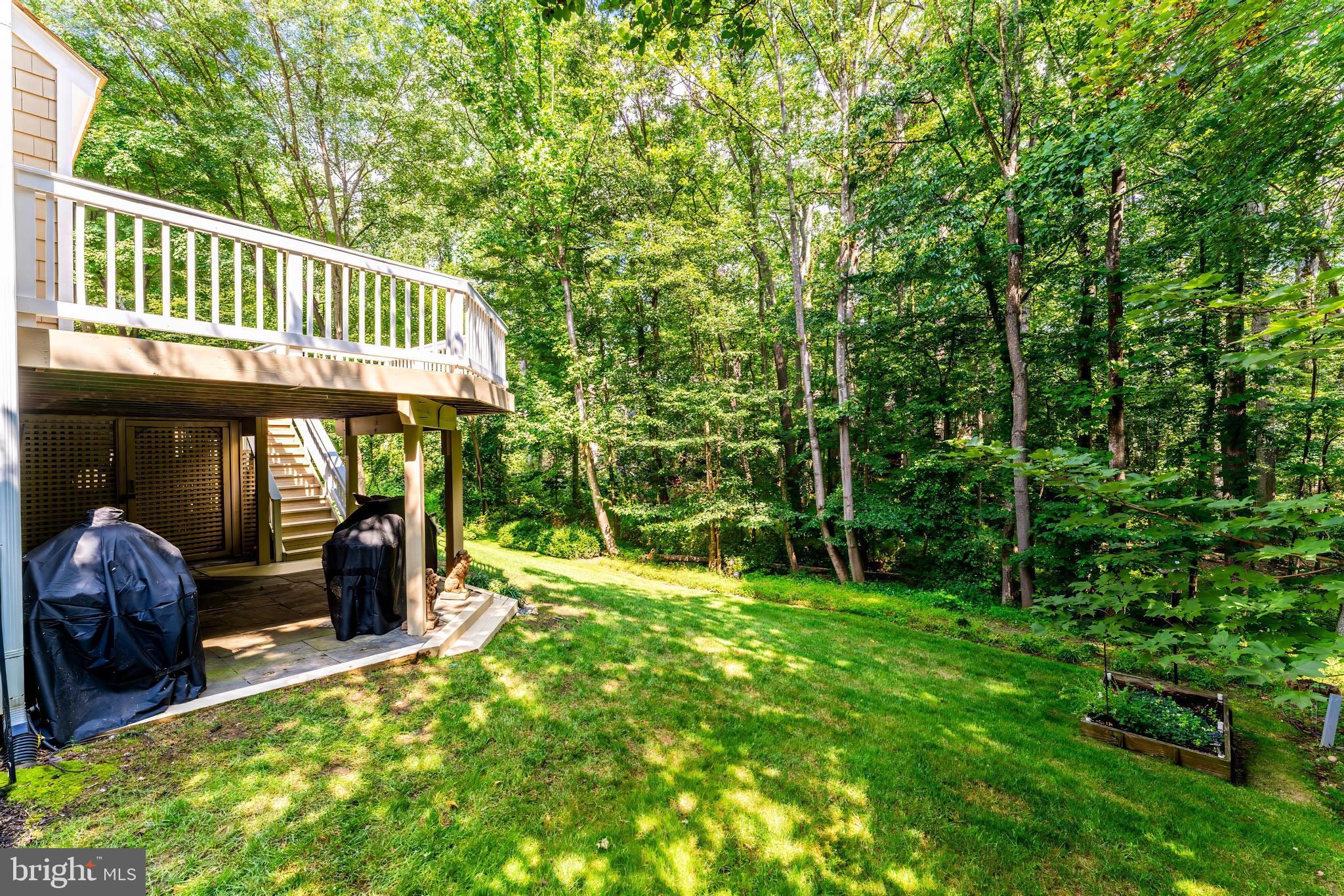 1248 Lamplighter Way Reston, VA 20194 - Photo 57 of 64 a view of a chair and tables in the backyard of the house