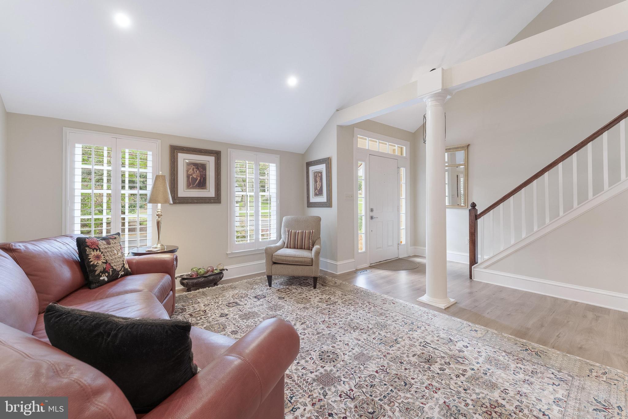 1248 Lamplighter Way Reston, VA 20194 - Photo 6 of 64 a living room with furniture or couch and a table