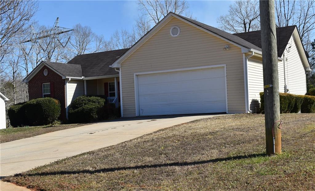 a front view of a house with garage