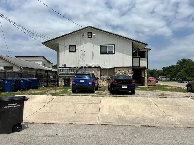 a view of a car park in front of house