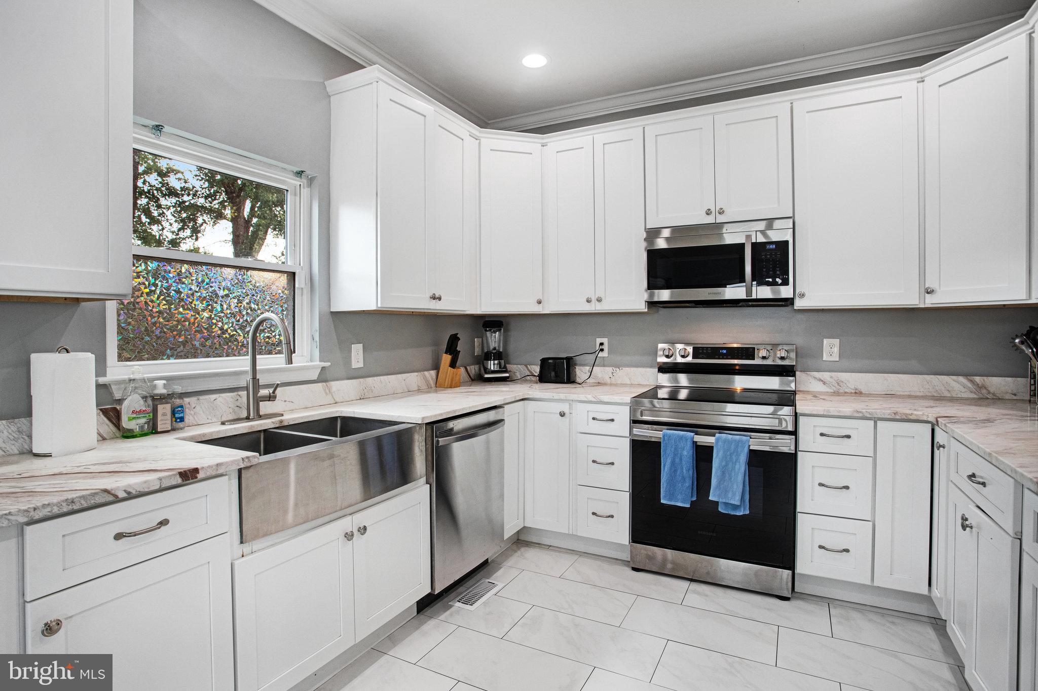 2452 24th Street Fredericksburg, VA 22408 - Photo 11 of 30 a kitchen with cabinets appliances a sink and a window