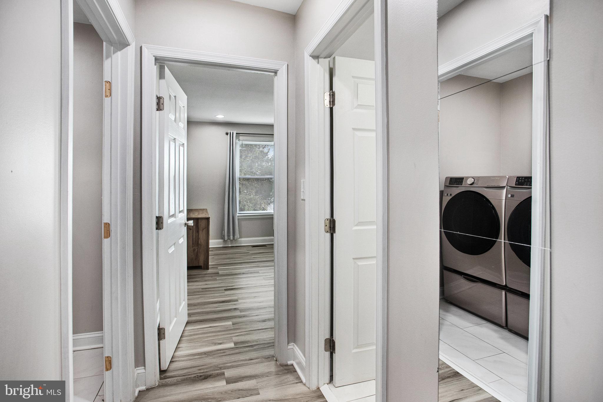 2452 24th Street Fredericksburg, VA 22408 - Photo 19 of 30 a view of a hallway view with wooden floor and staircase