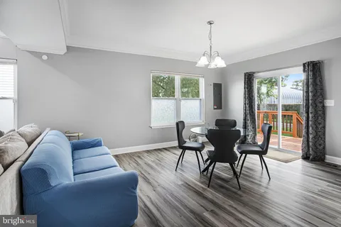 a view of a livingroom with furniture window and wooden floor