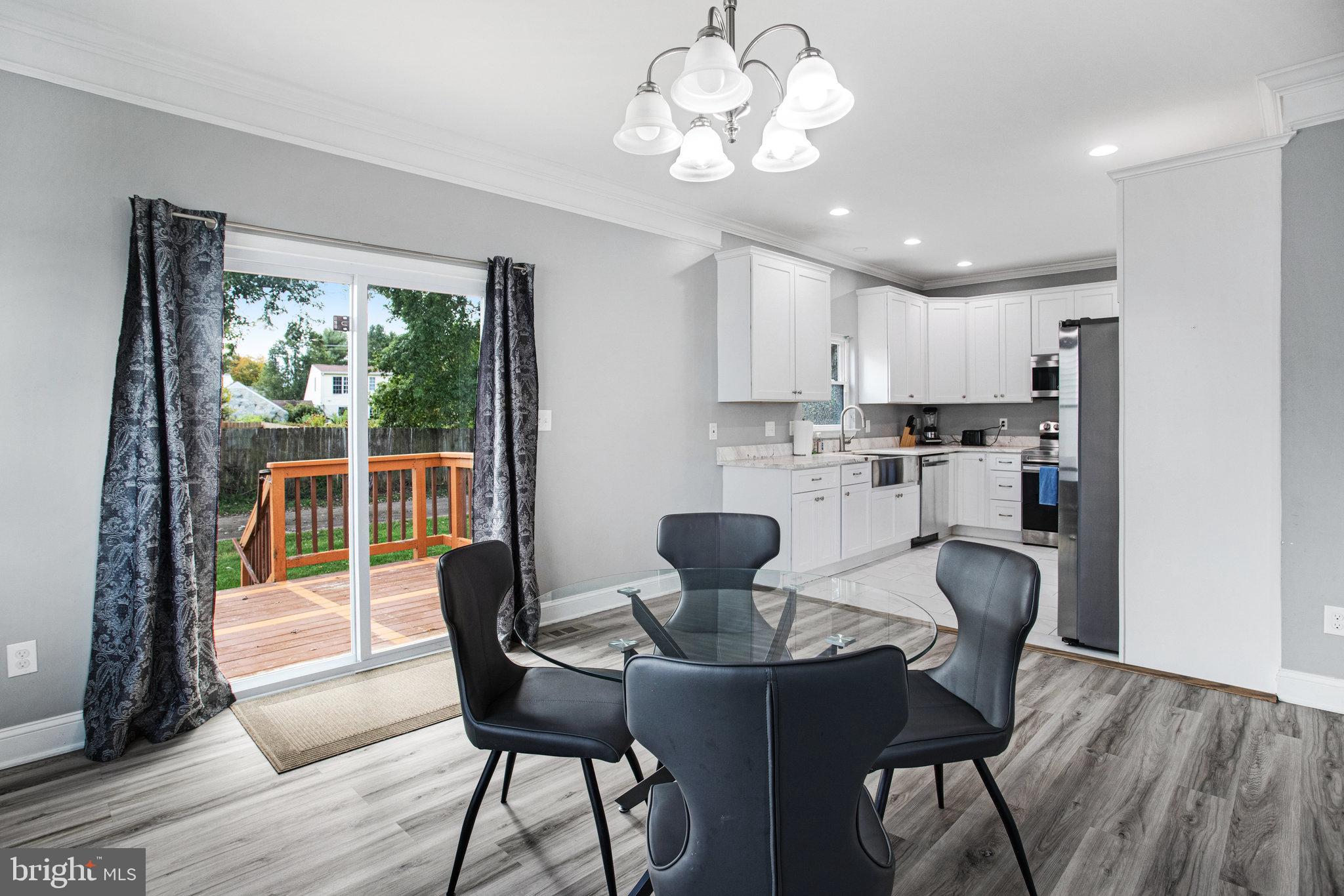 2452 24th Street Fredericksburg, VA 22408 - Photo 9 of 30 a view of a dining room with furniture window and wooden floor