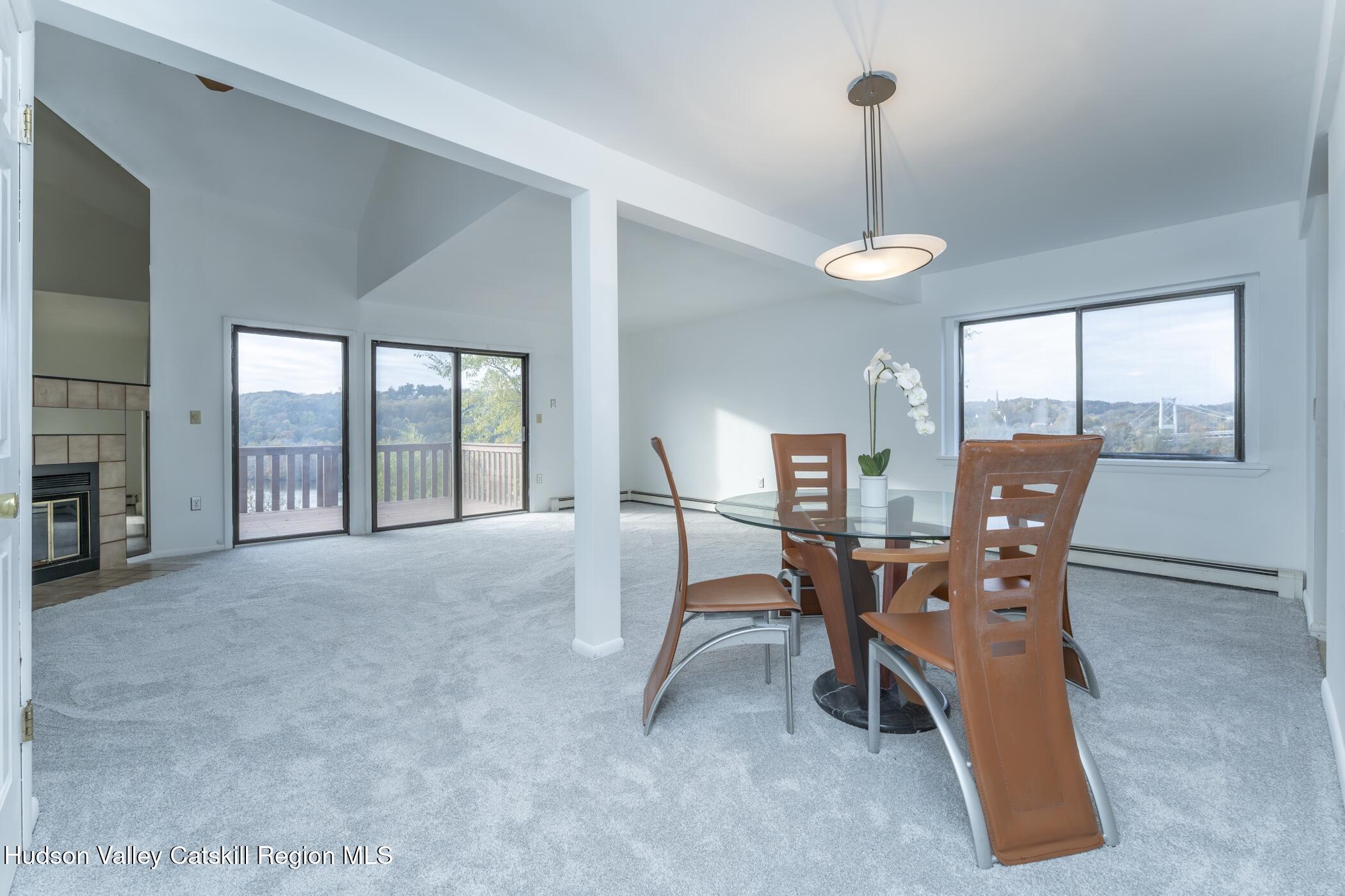 34 Rondout Harbor Port Ewen, NY 12466 - Photo 11 of 42 a view of a dining room with furniture wooden floor and chandelier