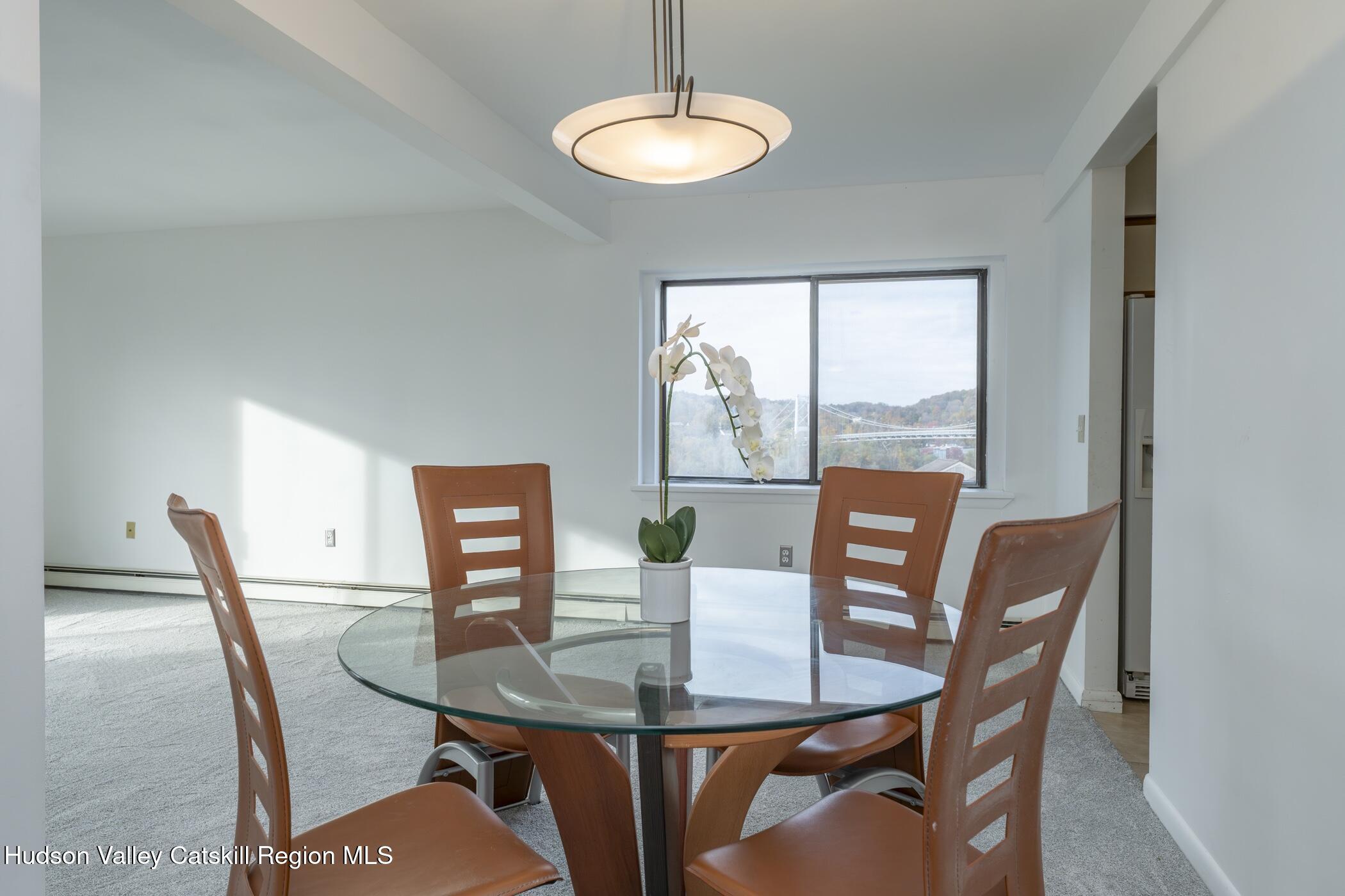 34 Rondout Harbor Port Ewen, NY 12466 - Photo 12 of 42 a view of a dining room with furniture window and wooden floor