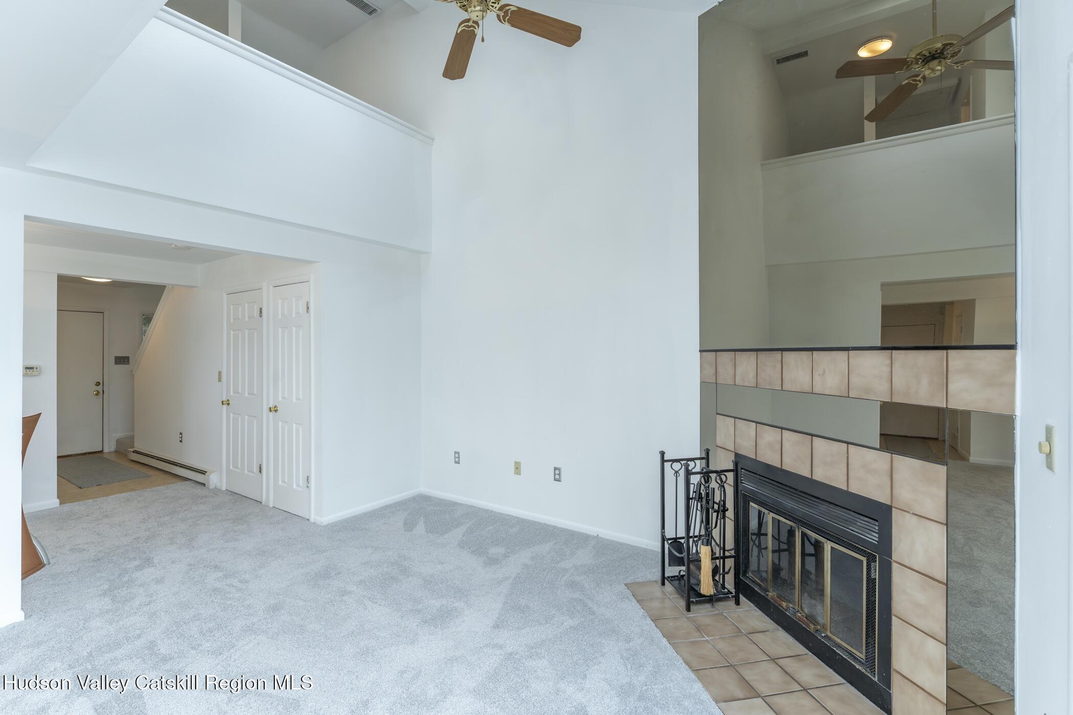 34 Rondout Harbor Port Ewen, NY 12466 - Photo 17 of 42 a view of an empty room with a fireplace