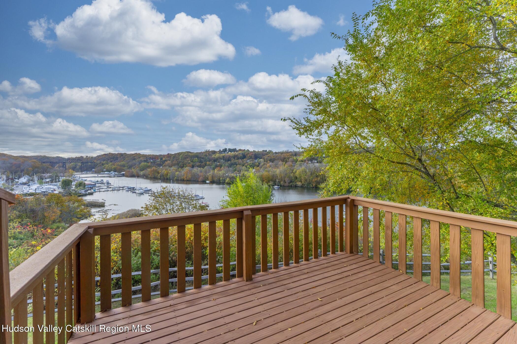 34 Rondout Harbor Port Ewen, NY 12466 - Photo 21 of 42 a balcony with wooden floor and fence