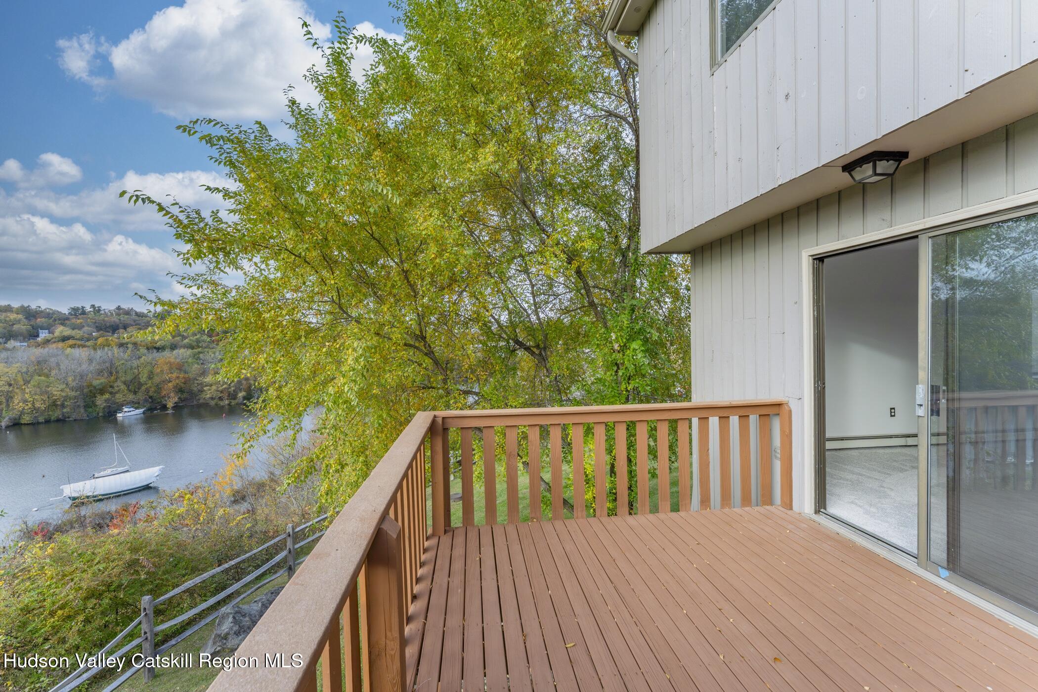 34 Rondout Harbor Port Ewen, NY 12466 - Photo 22 of 42 a balcony with wooden floor and lake view