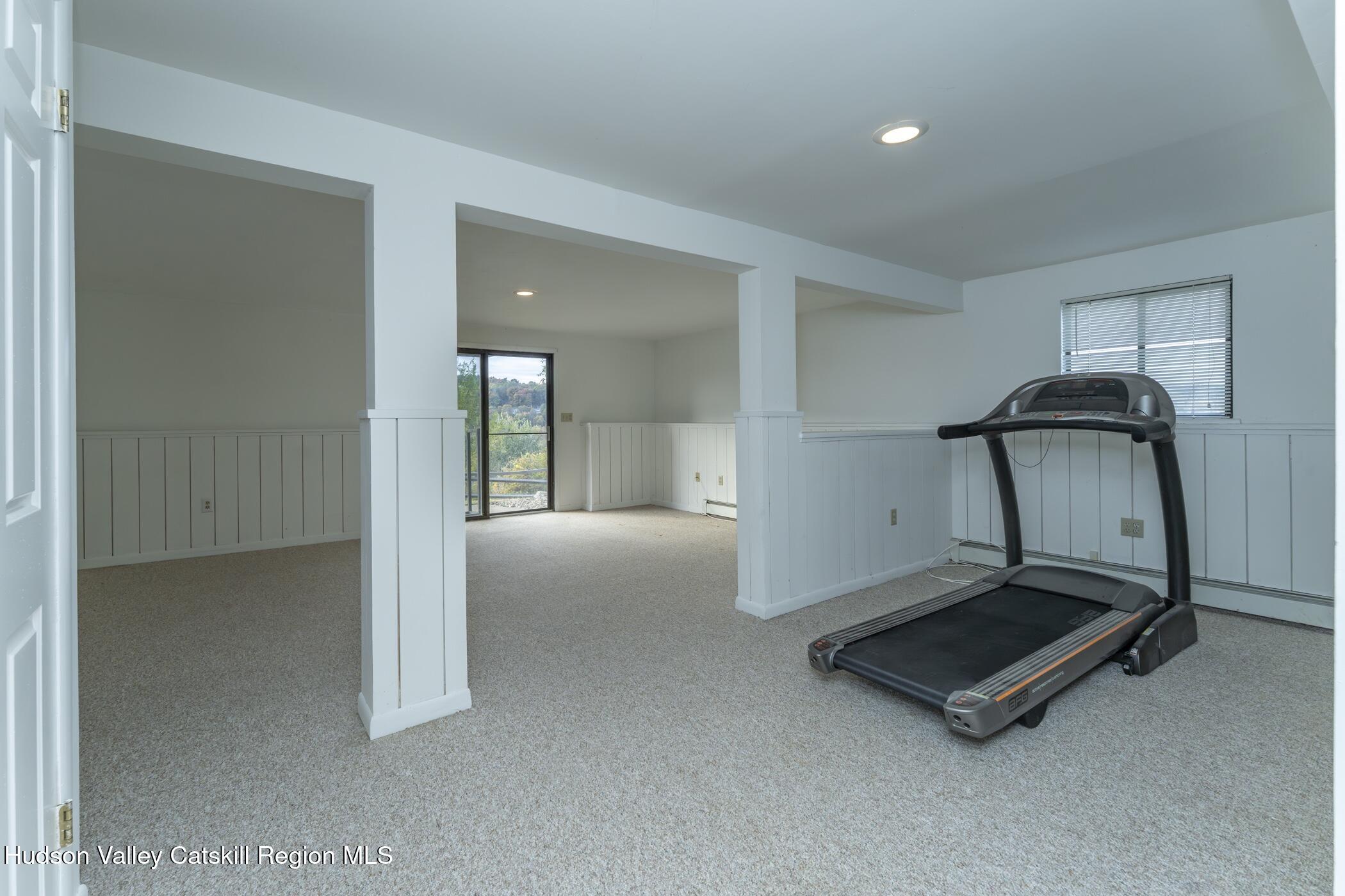 34 Rondout Harbor Port Ewen, NY 12466 - Photo 29 of 42 a room with gym equipment and a mirror
