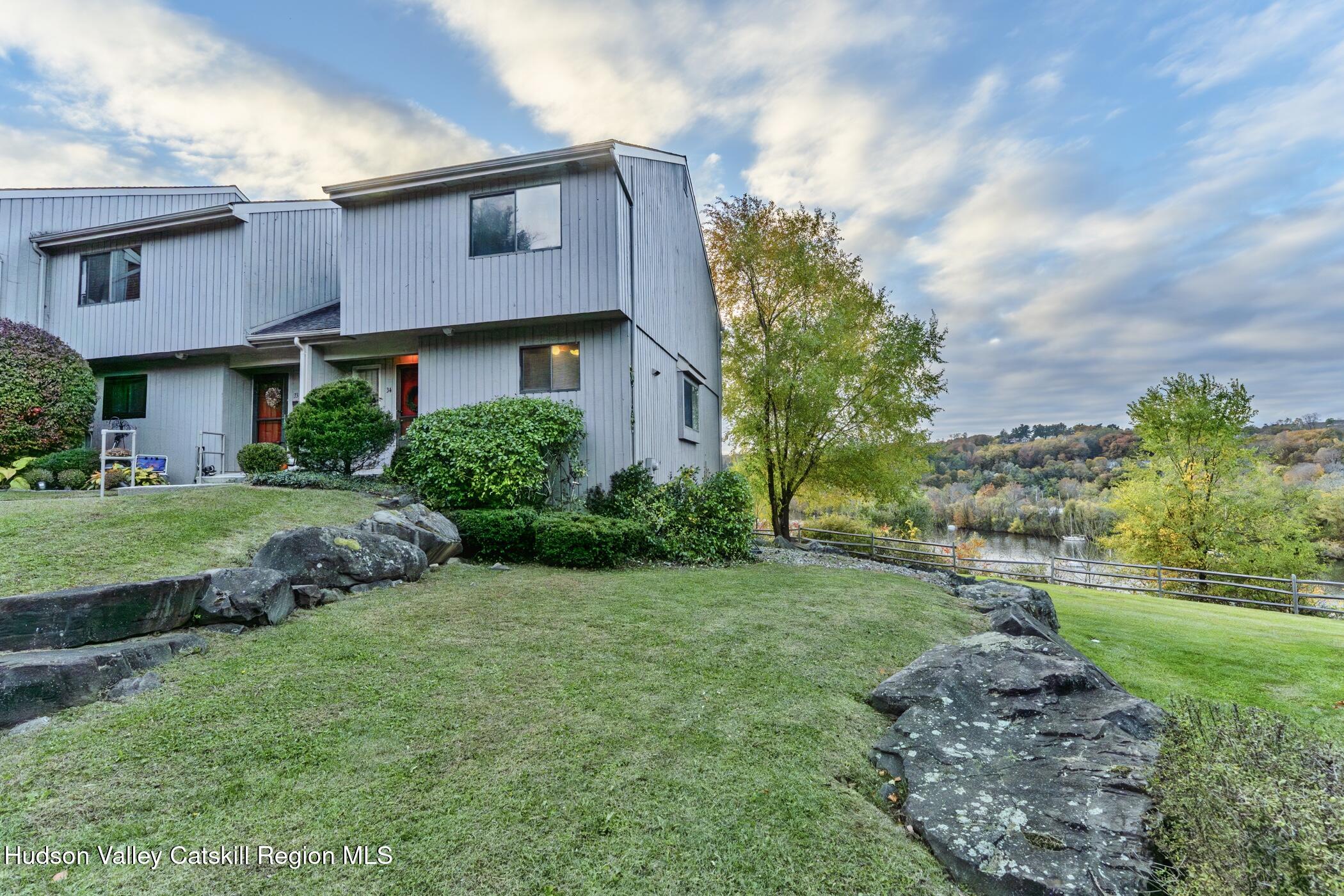 34 Rondout Harbor Port Ewen, NY 12466 - Photo 3 of 42 a front view of a house with a yard