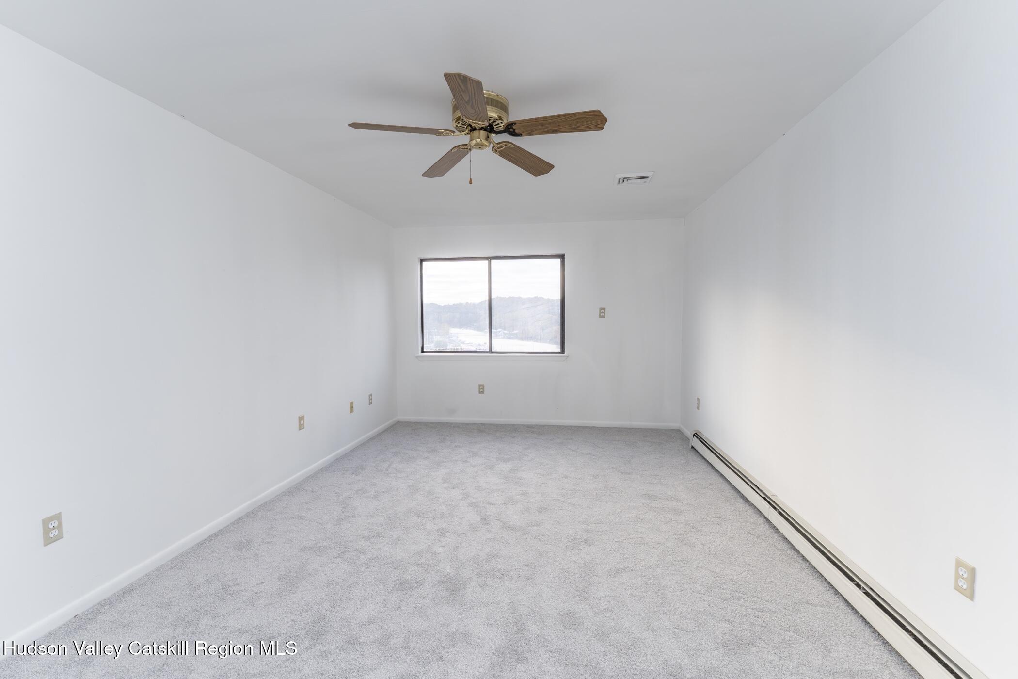 34 Rondout Harbor Port Ewen, NY 12466 - Photo 35 of 42 an empty room with windows and fan