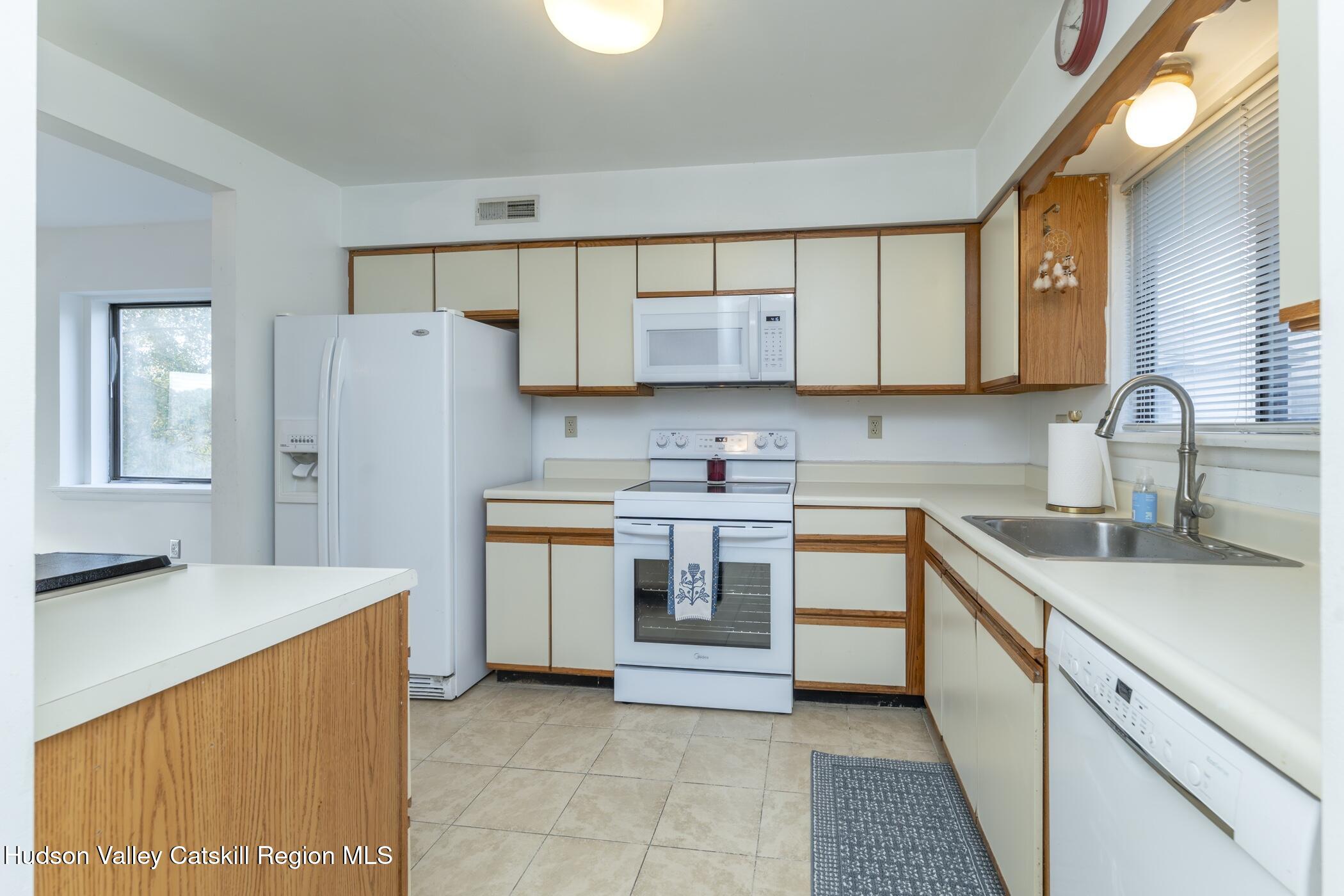 34 Rondout Harbor Port Ewen, NY 12466 - Photo 7 of 42 a kitchen with stainless steel appliances granite countertop a sink stove and refrigerator