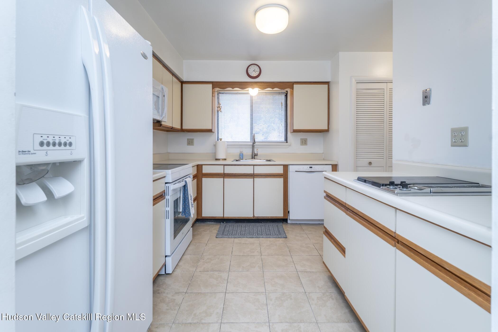 34 Rondout Harbor Port Ewen, NY 12466 - Photo 8 of 42 a kitchen with a stove sink and cabinets