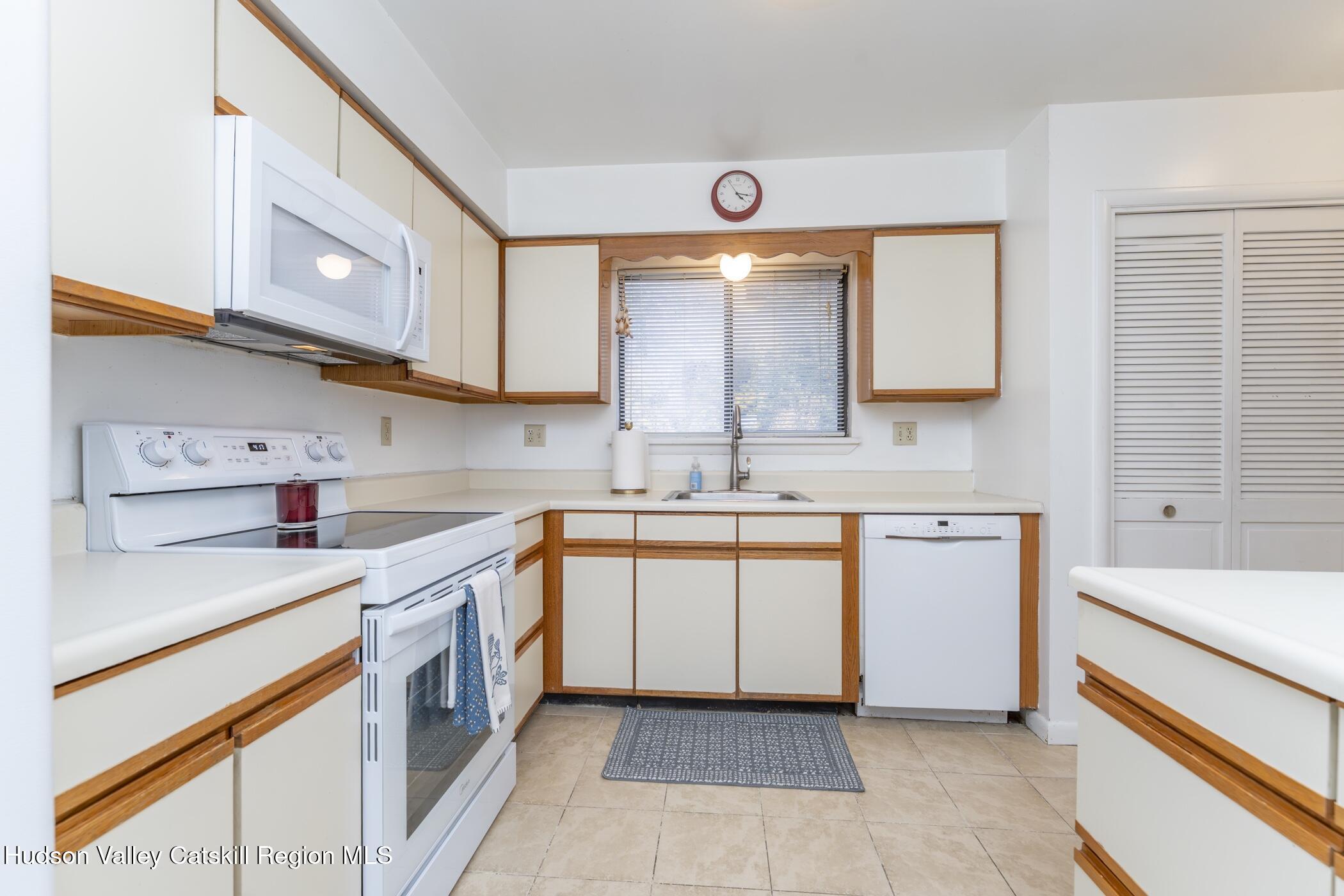 34 Rondout Harbor Port Ewen, NY 12466 - Photo 9 of 42 a kitchen with a sink stove and cabinets
