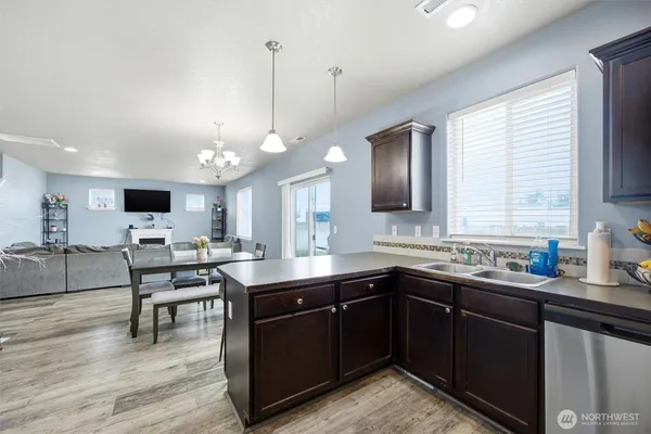 a kitchen with lots of counter top space and dining table