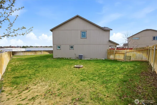 a view of a backyard with plants and a patio