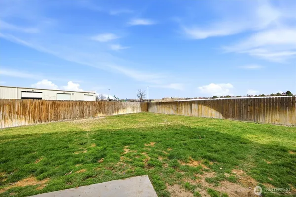 a view of a lake with houses in the back