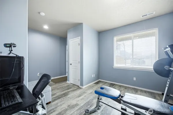 a workspace with furniture and a window