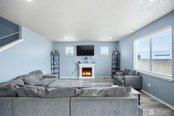 a living room with furniture and a flat screen tv