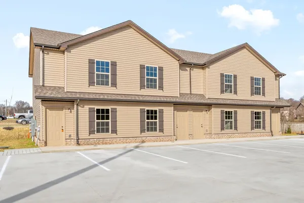 a view of a house with a street