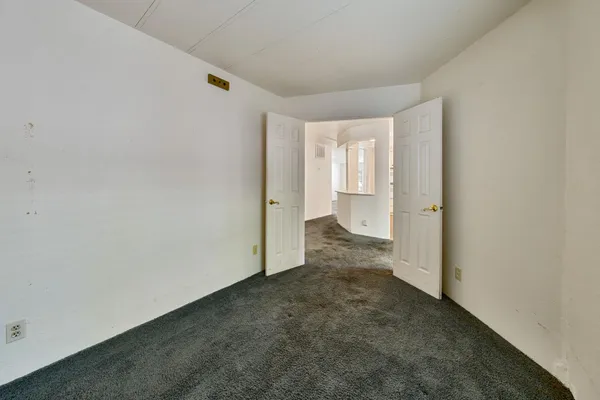 a view of a room with a hallway