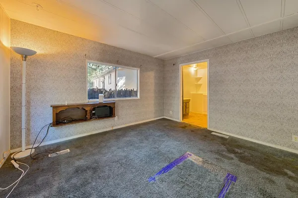 a view of livingroom with furniture and window