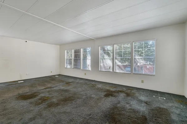 an empty room with windows